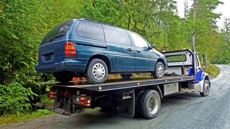 Winnipeg flatbed towing a cargo van