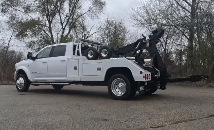 Winnipeg wrecker equipment securing damaged vehicle